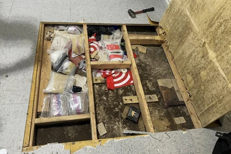 Police found large amounts of drugs and paraphernalia underneath a trap door in the daycare (NYPD/AP)