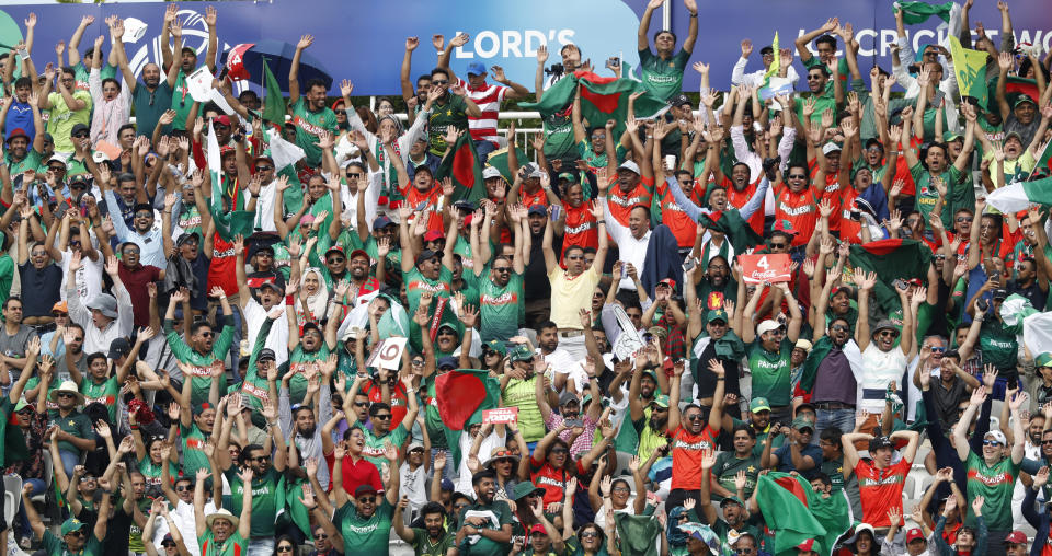 FILE - In this July 5, 2019, file photo, cricket fans take part in 'Mexican wave' as they watch the Cricket World Cup match between Pakistan and Bangladesh at Lord's cricket ground in London. Major League Baseball is trying to muscle in on a crowded marketplace in Britain dominated by soccer but also filled with cricket, rugby _ and this month Wimbledon. (AP Photo/Alastair Grant, File)