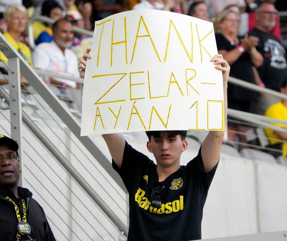 A fan holds a sign for former Columbus Crew forward Lucas Zelarayan before a match Monday against Club América in a Leagues Cup Central 1 group at Lower.com Field. The Crew have reached a transfer agreement with Al Fateh of the Saudi Pro League that will send Lucas Zelarayan there.