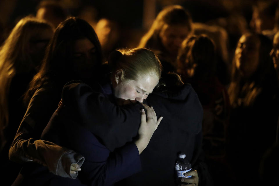 Students embrace during a vigil at Central Park in the aftermath of a shooting at Saugus High School Thursday, Nov. 14, 2019, in Santa Clarita, Calif. Los Angeles County sheriff’s officials say a 16-year-old student shot several classmates and then himself in a quad area of Saugus High School Thursday morning. (AP Photo/Marcio Jose Sanchez)