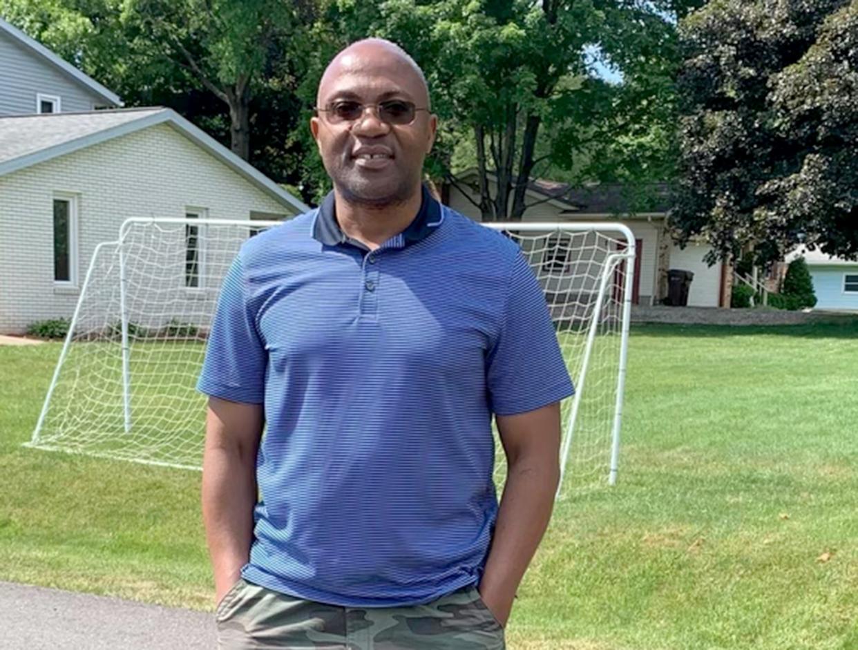 Eric Nshimiye, shown outside his Lake Township home.