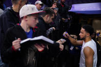 Brooklyn Nets' Ben Simmons signs autographs for fans before an NBA basketball game against the Philadelphia 76ers, Tuesday, Nov. 22, 2022, in Philadelphia. (AP Photo/Matt Slocum)