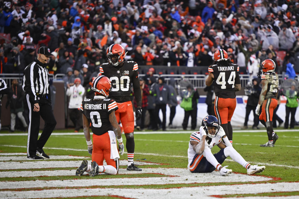 Chicago Bears wide receiver Darnell Mooney (11) sit on the field after an incomplete pass in the second half of an NFL football game against the Cleveland Browns in Cleveland, Sunday, Dec. 17, 2023. (AP Photo/David Richard)