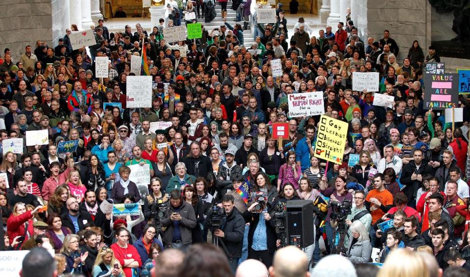 Supporters of gay marriage fill the rotunda as they gathered to rally at the Utah State Capitol Friday Jan. 10, 2014, and to deliver a petition with over 58,000 signatures in support of gay marriage to Utah Governor Gary Herbert. (AP Photo/Steve C. Wilson)