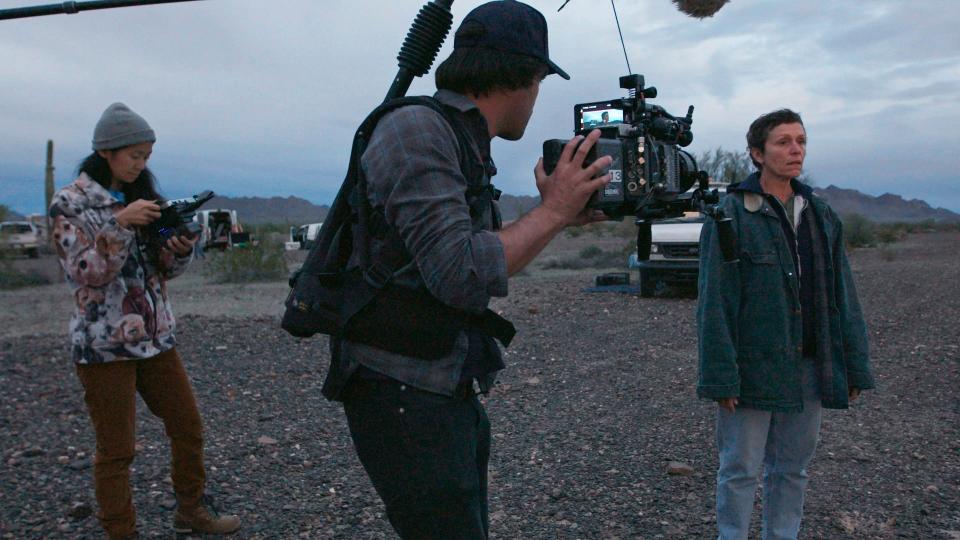 Chloé Zhao, left, director of photography Joshua James Richards and actress Frances McDormand on the set of "Nomadland."