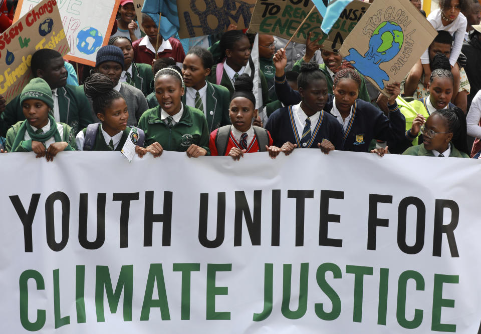 FILE - Young people take part in a protest calling for the government to take immediate action against climate change in Cape Town, South Africa, Sept. 24, 2022. UN Secretary-General António Guterres announced seven young climate leaders for his next Youth Advisory Group on Climate Change on Thursday, March 16, 2023. Guterres urged young climate advocates around the world to continue raising their voices in his announcement and said that the “unrelenting conviction” of young people is essential to keep climate goals within reach, lower fossil fuel emissions, and deliver climate justice. (AP Photo/Nardus Engelbrecht, File)