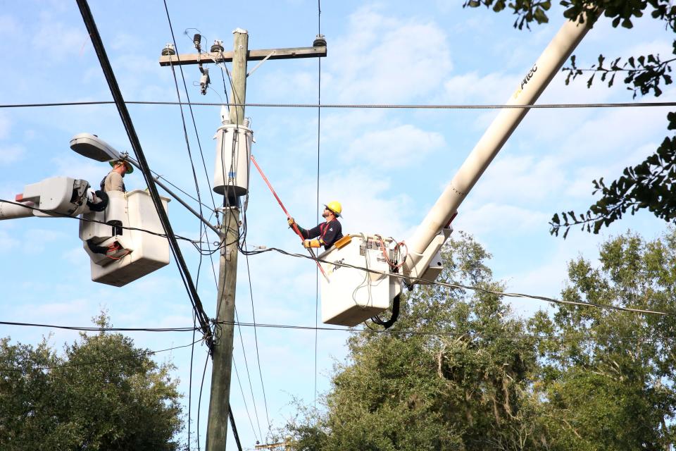 Talquin Electric Cooperative stands to receive $39 million in federal funding to connect more customers and make improvements to its power lines running through North Florida. In this photo, out-of-town crews work to restore power in the city of Tallahassee in 2018.
