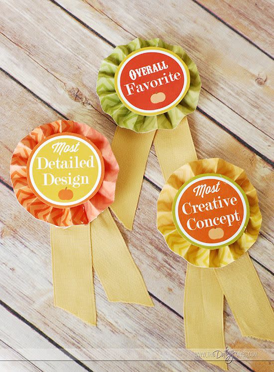 <p>What's a pumpkin carving contest without some awards? Print out these fun ribbons (and voting ballets included) to give your favorite gourd a fantastic prize.</p><p><strong>Get the tutorial at <a href="https://www.thedatingdivas.com/pumpkin-decorating-party/" rel="nofollow noopener" target="_blank" data-ylk="slk:The Dating Divas;elm:context_link;itc:0;sec:content-canvas" class="link ">The Dating Divas</a>.</strong></p>