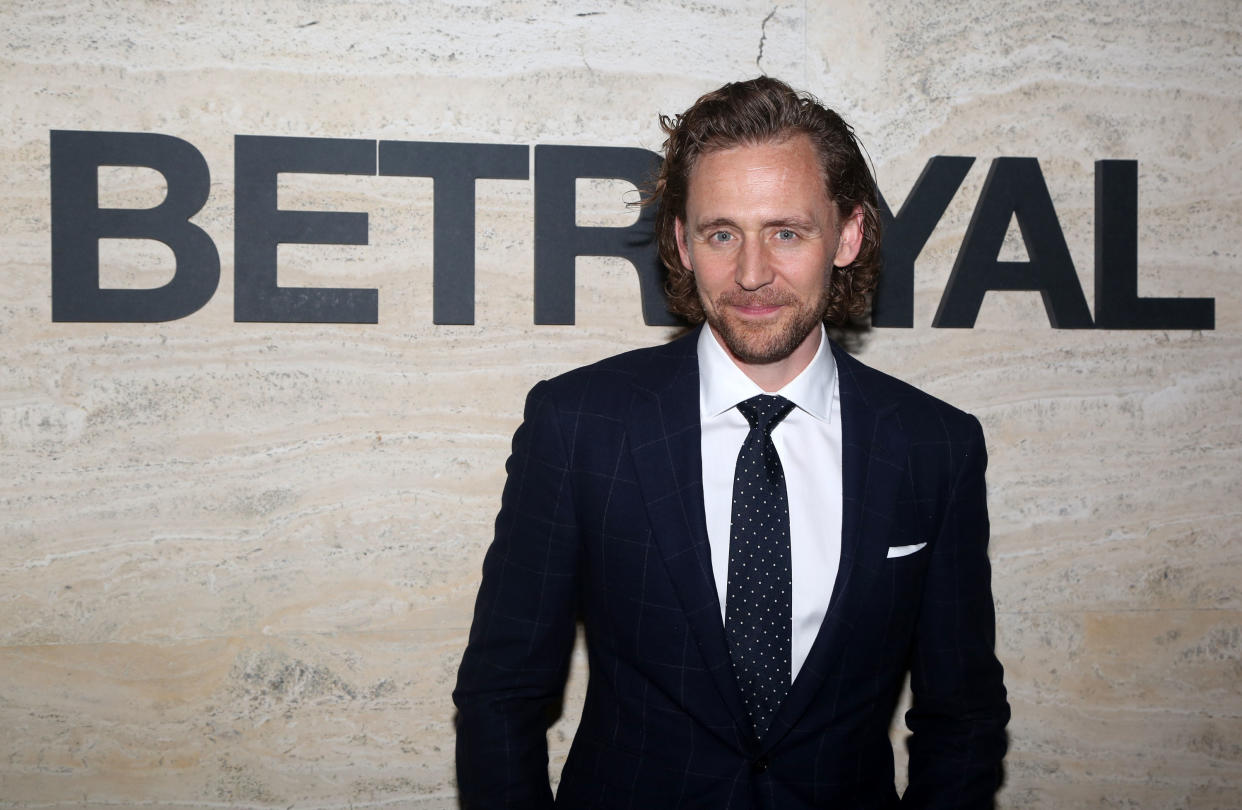 Tom Hiddleston poses at the opening night of 