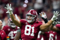 Alabama tight end Cameron Latu (81) signals a Georgia fourth down during the second half of the Southeastern Conference championship NCAA college football game, Saturday, Dec. 4, 2021, in Atlanta. (AP Photo/Brynn Anderson)