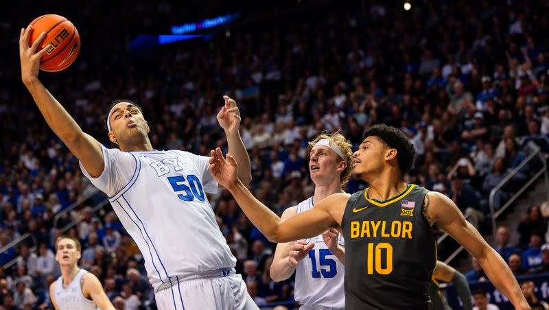 Brigham Young Cougars center Aly Khalifa (50) grabs a rebound during a men’s college basketball game between Brigham Young University and Baylor University at the Marriott Center in Provo on Tuesday, Feb. 20, 2024.