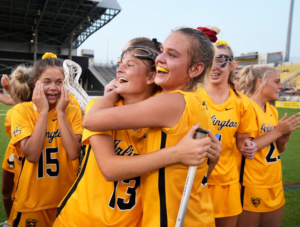 13. Lilly Boyle (13) and Abbie Dunlap (9) of Upper Arlington celebrate a 14-10 win over Olentangy Liberty in the Division I girls lacrosse state championship game.