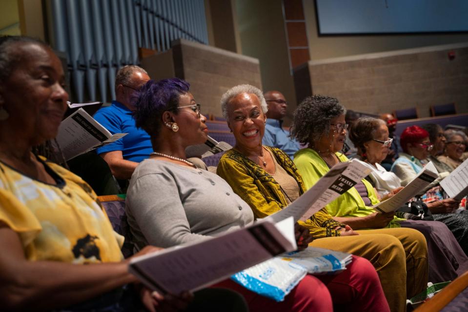 Members of the Brazeal Dennard Chorale talk and laugh in between rehearing songs at Tabernacle Missionary Baptist Church in Detroit on Tuesday, June 6, 2023. 