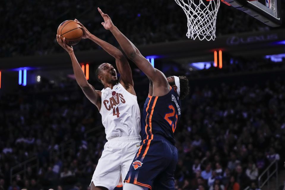 Cleveland Cavaliers' Evan Mobley (4) shoots over New York Knicks' Mitchell Robinson (23) during the first half of an NBA basketball game Wednesday, Nov. 1, 2023, in New York. (AP Photo/Frank Franklin II)