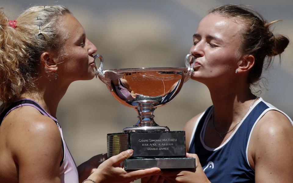 Barbora Krejcikova and Katerina Siniakova celebrate winning the women's doubles title - Shutterstock