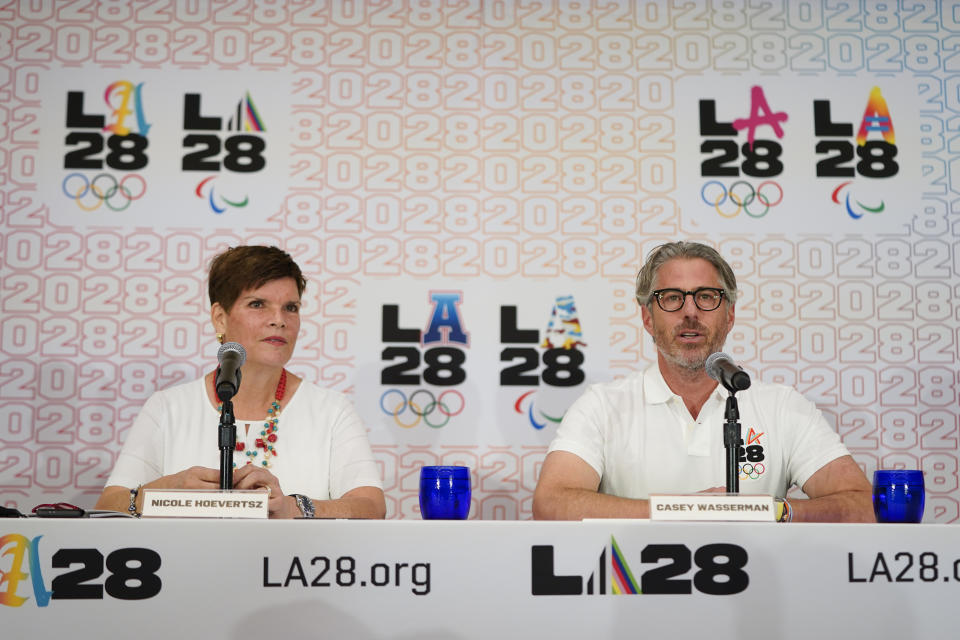 LA28 Chairperson Casey Wasserman, right, speaks during a news conference as he is joined by Nicole Hoevertsz, IOC member and LA28 coordination commission chair, Thursday, Sept. 15, 2022, in Los Angeles, updating their progress in planning the 2028 Los Angeles Olympics games. (AP Photo/Jae C. Hong)