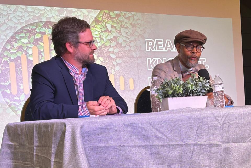 Savannah-Chatham School Board District 7 representative Michael Johnson (left) listens as challenger Jay Jones responds to a question during a school board election forum on Sunday May 19, 2024 at Front Porch Improv.