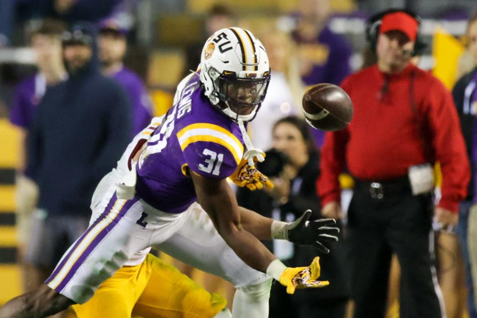 Nov 20, 2021; Baton Rouge, Louisiana, USA; LSU Tigers safety Cameron Lewis (31) steps in to block the pass attempt for Louisiana Monroe Warhawks during the second half at Tiger Stadium. Mandatory Credit: Stephen Lew-USA TODAY Sports