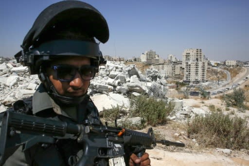 Before dawn, hundreds of Israeli police and soldiers sealed off buildings in the area close to the Israeli separation barrier which cuts off the West Bank