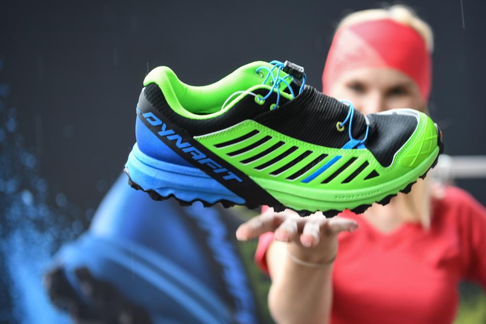 Model Jette throwing the trail running shoe Alpine Pro of manufacturer Dynafit one day before the start of the Outdoor fair in Friedrichshafen, Germany, 12 July 2016. The shoe weighs less than 300 gramm. PHOTO: FELIX KAESTLE/dpa | usage worldwide   (Photo by Felix Kästle/picture alliance via Getty Images)