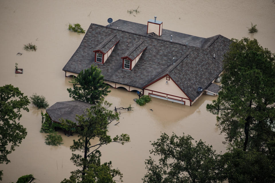 A Houston house sits submerged in floodwater after Hurricane Harvey. (Photo: Marcus Yam/Los Angeles Times via Getty Images)