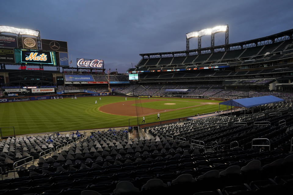 FILE - In this Sept. 9, 2020, file photo, Citi Field is viewed at dusk before a baseball game between the New York Mets and the Baltimore Orioles in New York. Billionaire hedge fund manager Steve Cohen has agreed to purchase the Mets from the Wilpon family. The team announced the agreement on Monday, Sept. 14, 2020. The deal is subject to the approval of Major League Baseball owners. (AP Photo/Kathy Willens, File)