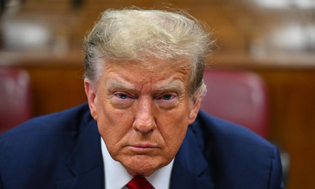 <span>Donald Trump attends the first day of his hush-money trial in New York, on Monday.</span><span>Photograph: Angela Weiss/EPA</span>