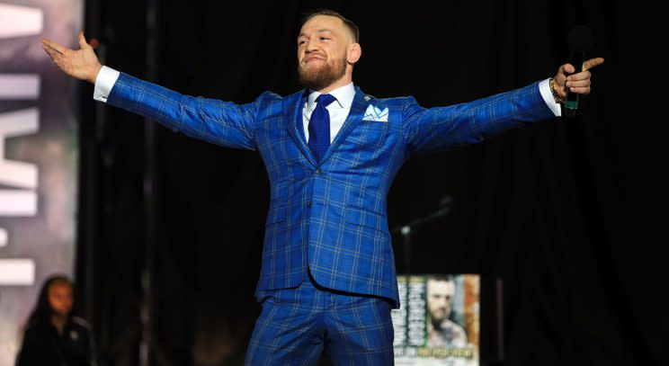 Conor McGregor gestures to the crowd in Toronto during a promotional tour for his fight against Floyd Mayweather on Aug. 26. (Vaughn Ridley/Getty Images)