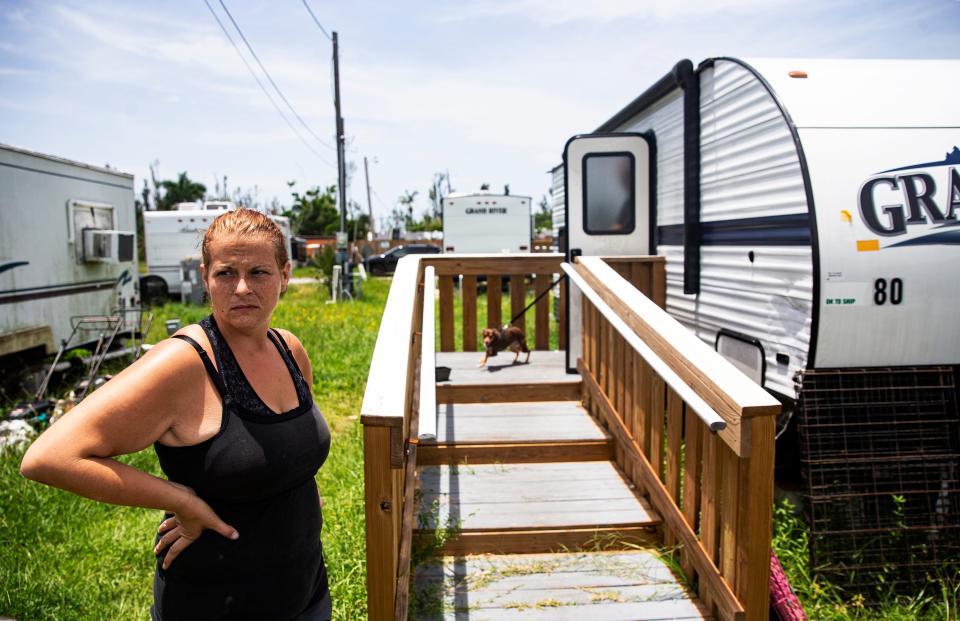 Geri Mendoza prepares to move out of her FEMA trailer at the Palms on Pine Island on July 26. She and her family were moving in with family members. She and her husband decided to leave the small trailer after FEMA wanted to relocate them to another trailer at a different location.