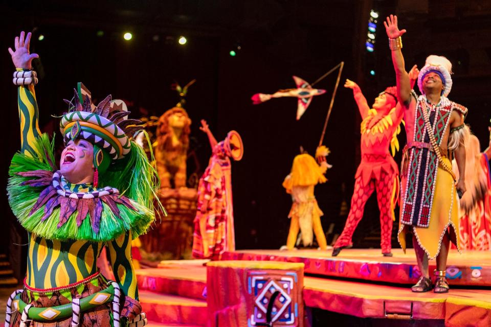 Performers sing during the Festival of the Lion King at Animal Kingdom.