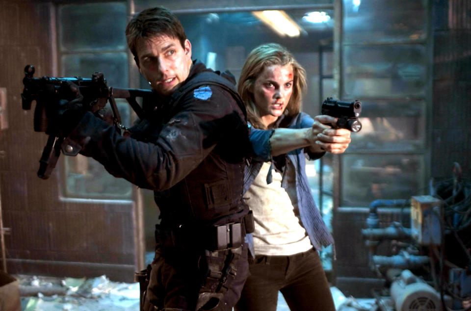 Tom Cruise and Keri Russell pointing guns in "Mission: Impossible III"