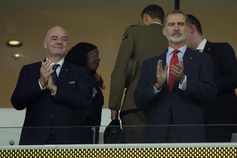 FILE - King Felipe VI of Spain, right, and FIFA President Gianni Infantino applaud before the World Cup group E soccer match between Spain and Costa Rica, at the Al Thumama Stadium in Doha, Qatar, Wednesday, Nov. 23, 2022. A unique 2030 World Cup is set to be played in Europe and Africa with the surprising addition of South America. The Spain-Portugal bid that grew to add Morocco this year also now includes long-time bid rivals Argentina, Paraguay and Uruguay. (AP Photo/Alessandra Tarantino, file)