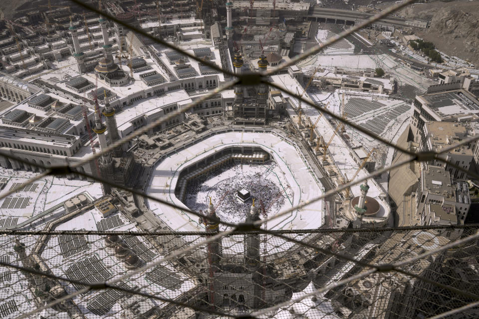 A general view of the Grand Mosque is seen through the fence of the Clock Tower during the Hajj pilgrimage in the Muslim holy city of Mecca, Saudi Arabia, Sunday, June 25, 2023. (AP Photo/Amr Nabil)