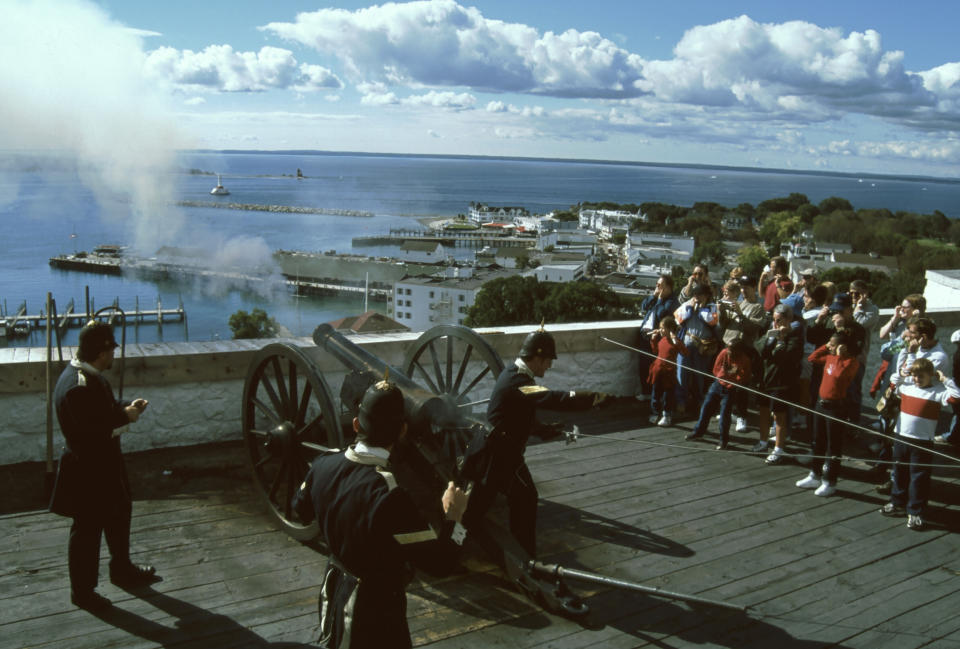 This undated photo from Mackinac State Historic Parks shows cannon firing demonstrations by costumed interpreters at Fort Mackinac on Mackinac Island, Mich., on Lake Huron, an important site in the War of 1812. The bicentennial of the war is being marked by events around the country. (AP Photo/Mackinac State Historic Parks)