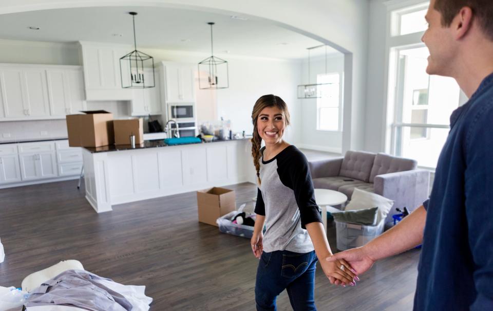 A millennial couple moving into their new home. - Copyright: Getty Images