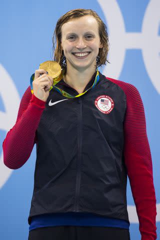 <p>Donald Miralle /Sports Illustrated via Getty</p> Katie Ledecky victorious with gold medal after Women's 200M Freestyle Finals