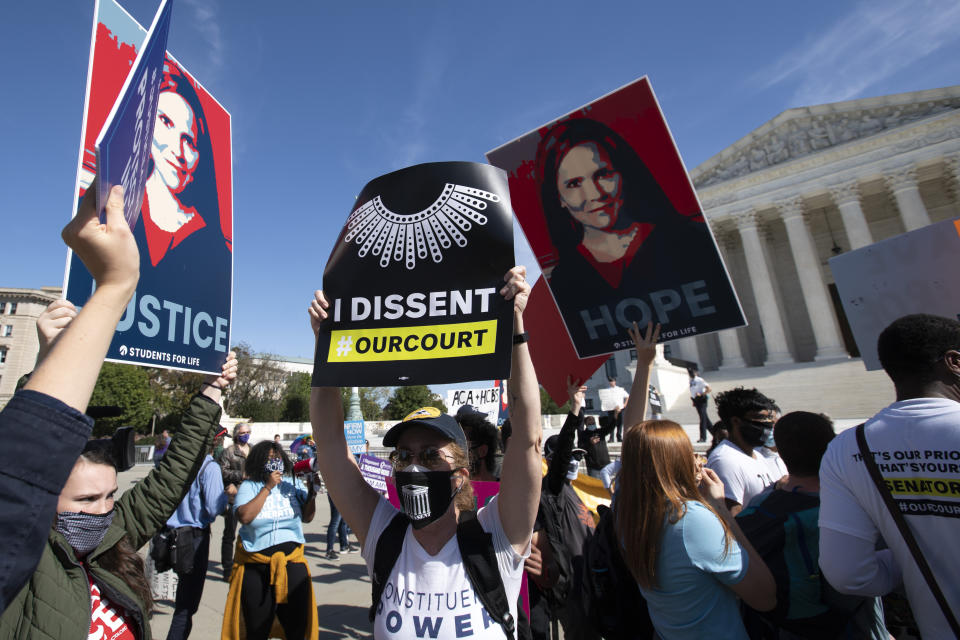 People protest for and against the confirmation of President Donald Trump's Supreme Court nominee Amy Coney Barrett, rally at the Supreme Court on Capitol Hill, in Washington, Wednesday, Oct. 14, 2020. (AP Photo/Jose Luis Magana)