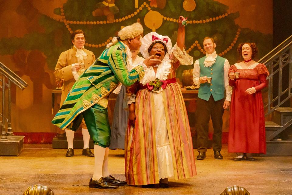 One of the most jubilant scenes in the Playhouse in the Park’s new production of “A Christmas Carol” is the Christmas party hosted by Mr. and Mrs. Fezziwig (Kenneth Early, left, and Burgess Byrd).