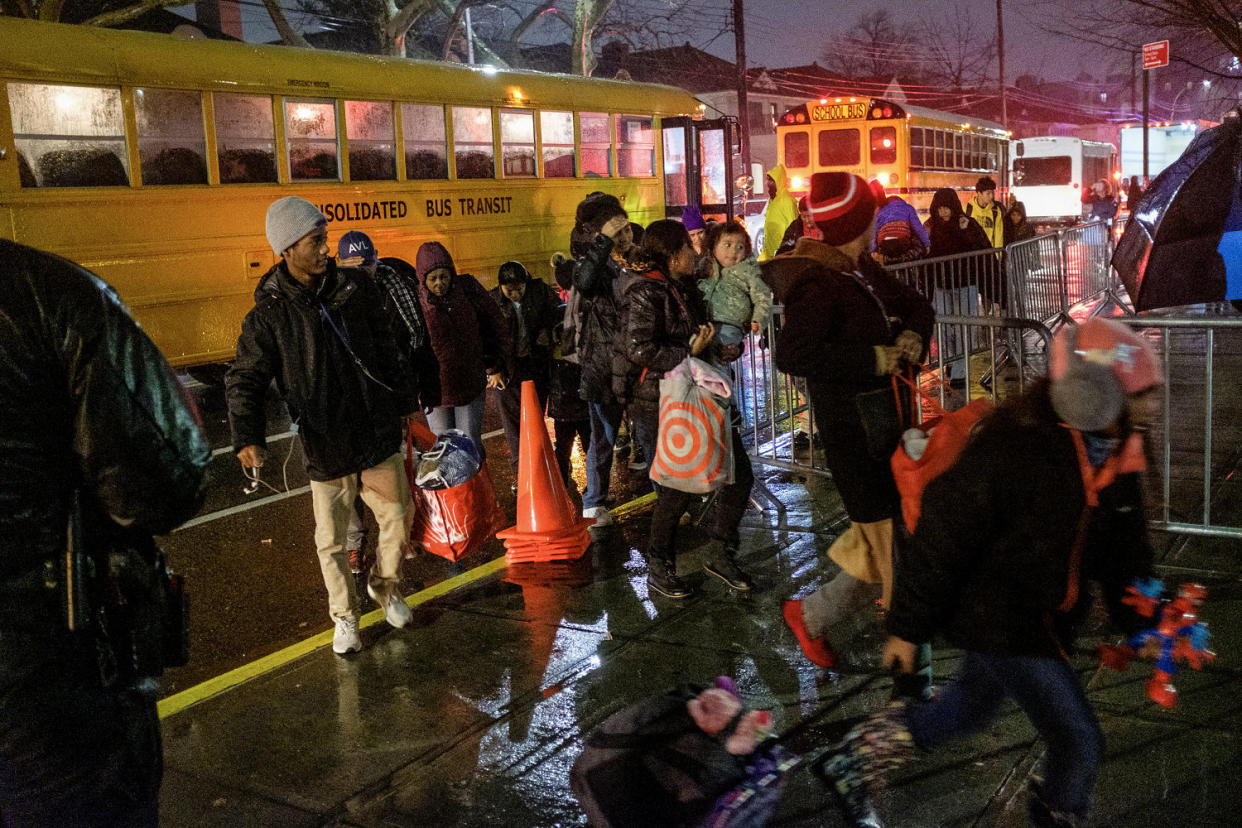 Migrants evacuated from Floyd Bennett Field arrive at James Madison High School on Bedford Avenue in Brooklyn, New York during a storm on Jan. 9, 2024. (Gardiner Anderson / NY Daily News via Getty Images)