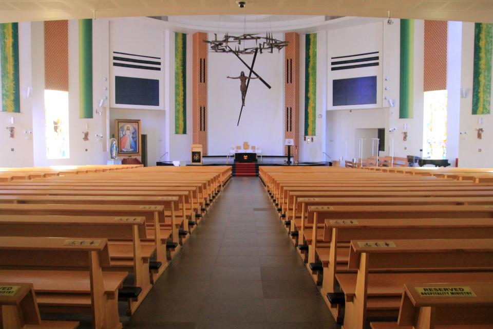 This photograph taken on February 23, 2020 shows empty pews inside the Roman Catholic Church after all public masses were indefinitely suspended as a protective measure to prevent the spread of the COVID-19 coronavirus in Singapore. - Health fears from the new coronavirus sweeping across the world have forced large public gatherings in Singapore like religious services to be cancelled. On February 15, the city-state's Roman Catholic archdiocese suspended all public masses indefinitely, offering pre-recorded services for the faithful to watch or listen to at home via YouTube or the church radio. (Photo by Martin ABBUGAO / AFP) (Photo by MARTIN ABBUGAO/AFP via Getty Images)