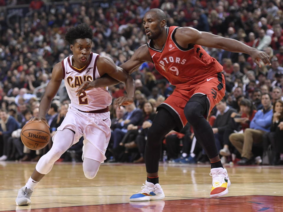 Cleveland Cavaliers guard Collin Sexton (2) drives towards the basket as Toronto Raptors forward Serge Ibaka (9) defends during second half NBA basketball action in Toronto on Wednesday, Oct. 17, 2018. (Nathan Denette/The Canadian Press via AP)