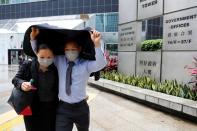 The Wider Image: On trial on riot charges, Hong Kong newlyweds prepared for life apart