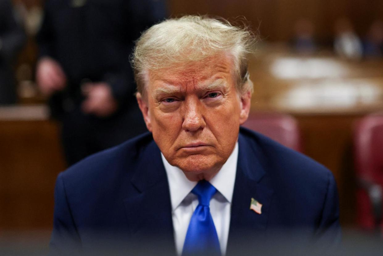 <span>Donald Trump sits in the courtroom in New York City on Thursday.</span><span>Photograph: Brendan McDermid/Reuters</span>