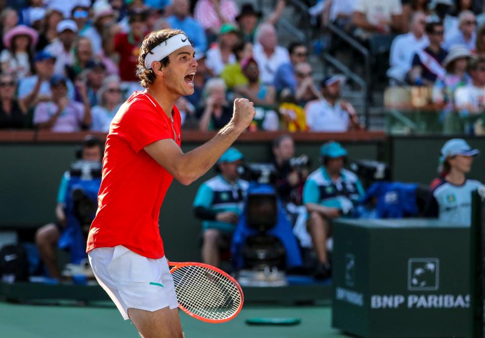 Taylor Fritz of the United States celebrates going into the first match point against Rafael Nadal of Spain before Nadal forces a tiebreaker during the ATP singles final at the BNP Paribas Open at the Indian Wells Tennis Garden in Indian Wells, Calif., Sunday, March 20, 2022. 