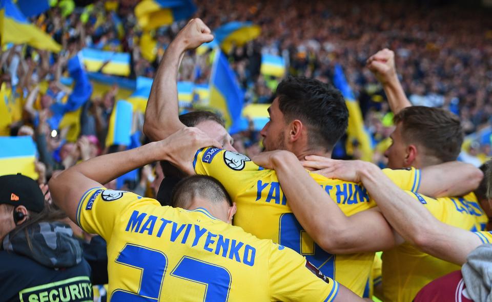 Amid the backdrop of the Russian invasion back home, Roman Yaremchuk (center) and Ukraine beat Scotland on Wednesday and will now face Wales for the right to go to the World Cup. (Photo by ANDY BUCHANAN/AFP via Getty Images)