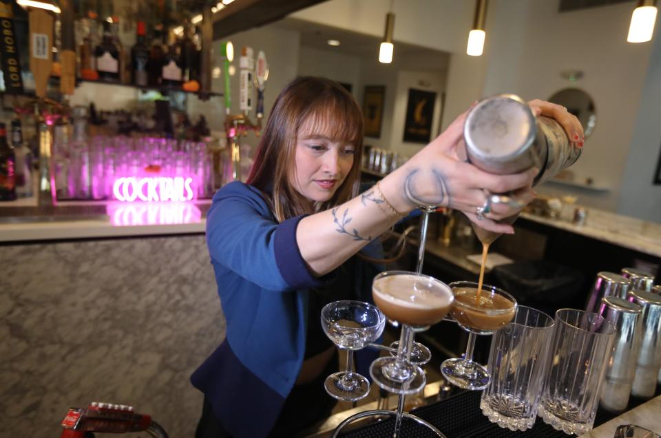 Leora Deisenroth, bar manager, makes a cookie dough whiskey espresso martini at Branca Midtown in Rochester Friday, Oct. 20, 2023.
