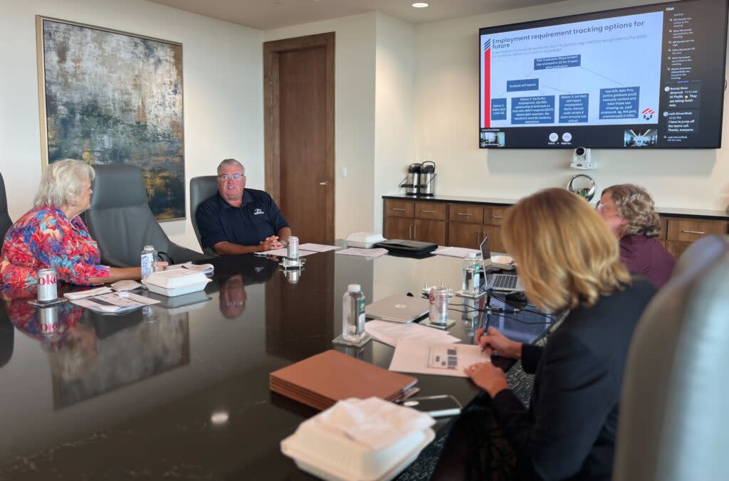 South Dakota Freedom Scholarship Board Chair Dana Dykhouse (center) talks with board member Diana Vanderwoude (left) during the group's July 22, 2024 board meeting in Sioux Falls. (Joshua Haiar/South Dakota Searchlight)