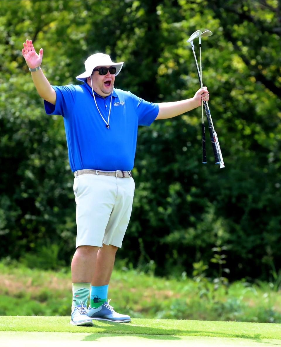 Bradley Brown of Murfreesboro reacts as his partner Jim Bjork, sinks a putt on the 3rd hold during the Special Olympics Tennessee Middle Tennessee Golf Regional on Monday, Aug. 15, 2022, at Old Fort Park Golf Club. 