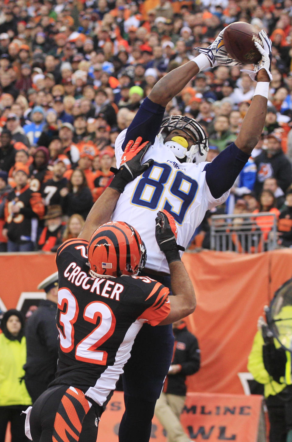 San Diego Chargers tight end Ladarius Green (89) catches a 4-yard touchdown pass against Cincinnati Bengals safety Chris Crocker (32) in the second half of an NFL wild-card playoff football game on Sunday, Jan. 5, 2014, in Cincinnati. (AP Photo/Tom Uhlman)