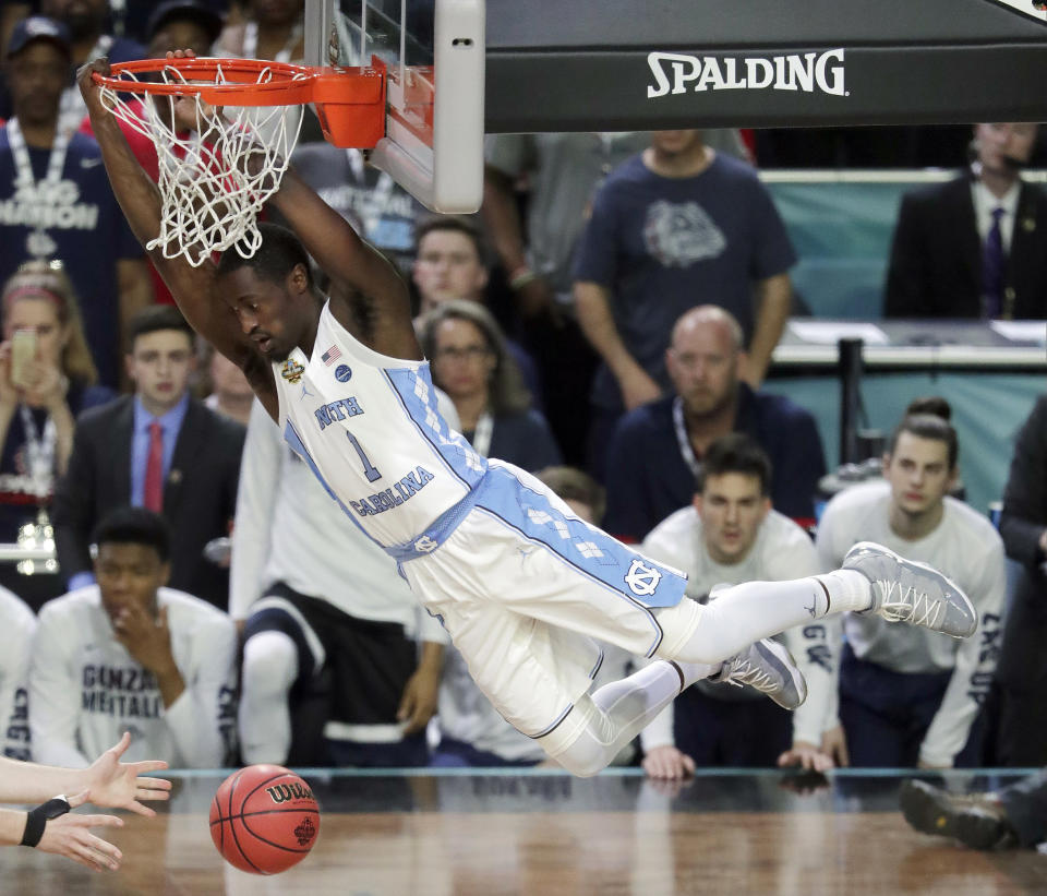 North Carolina’s Theo Pinson (1) dunks during the first half of the national title game against Gonzaga on April 3, 2017, in Glendale, Ariz. (AP Photo/Matt York)